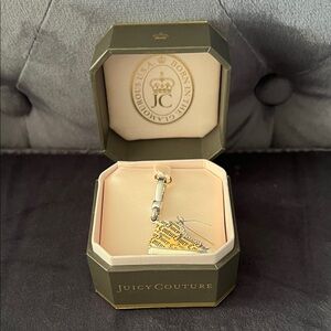 Juicy Couture High top silver sneaker charm.